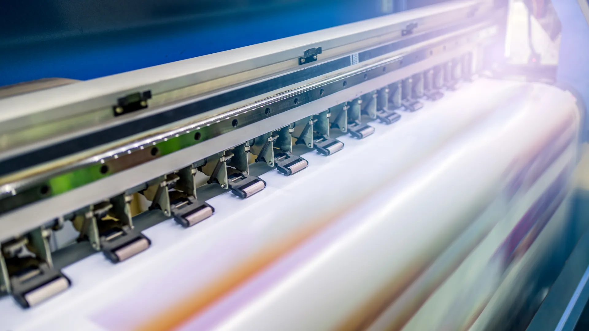Visual Branding | Home Wide-format printer printing a vinyl banner